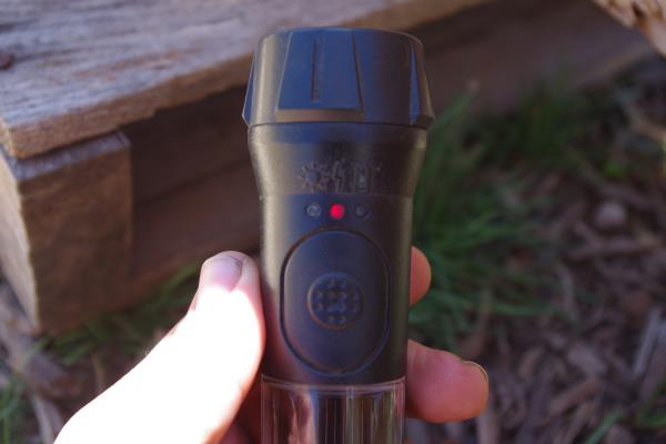 red light charging on solar off-grid flashlight